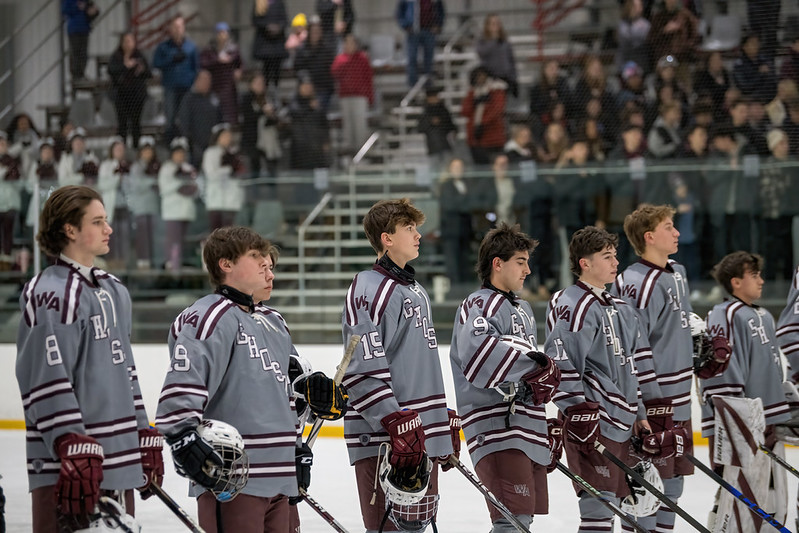 Westford Academy Ghosts hockey team lined up on the ice
